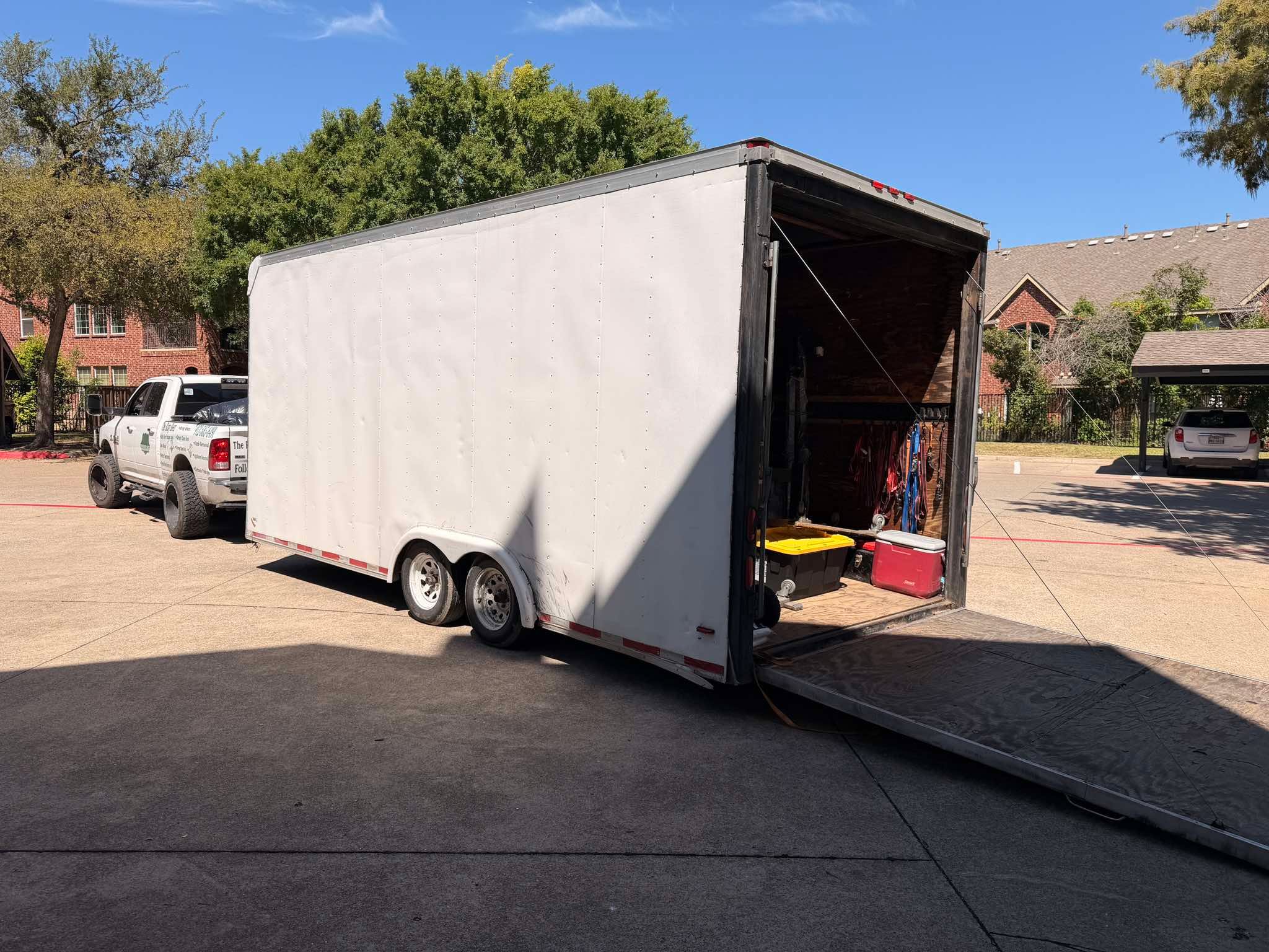 Enclosed cargo trailer with ramp down at job site