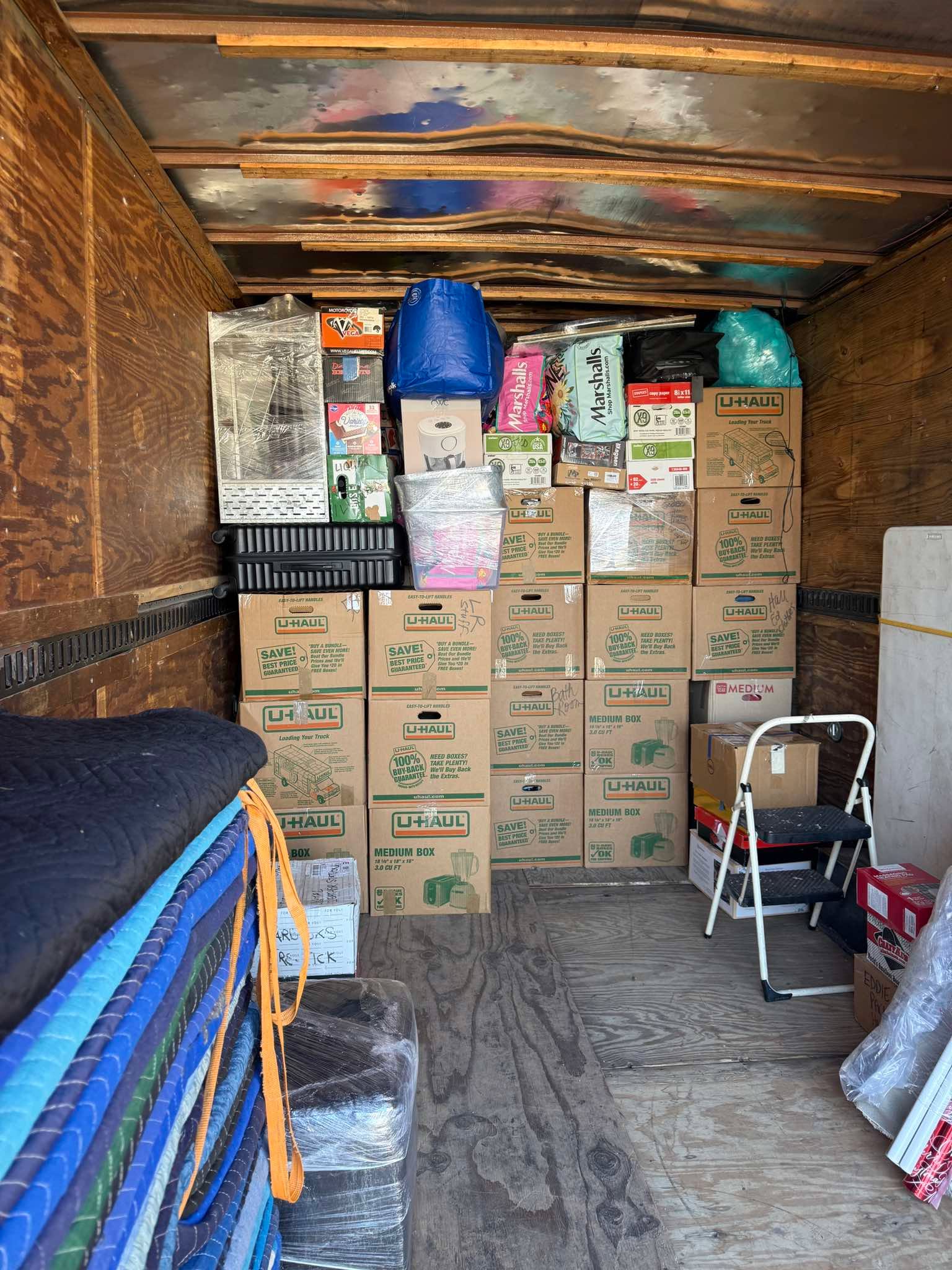 Moving truck packed floor to ceiling with boxes