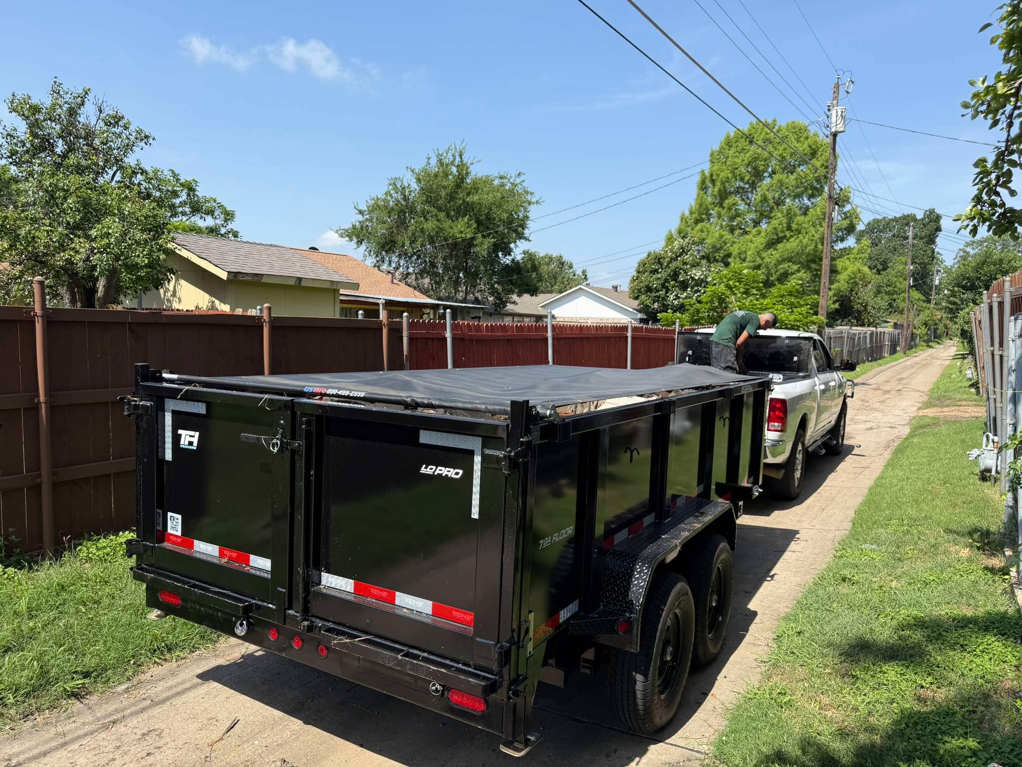 Dump trailer tarp secured after a residential haul